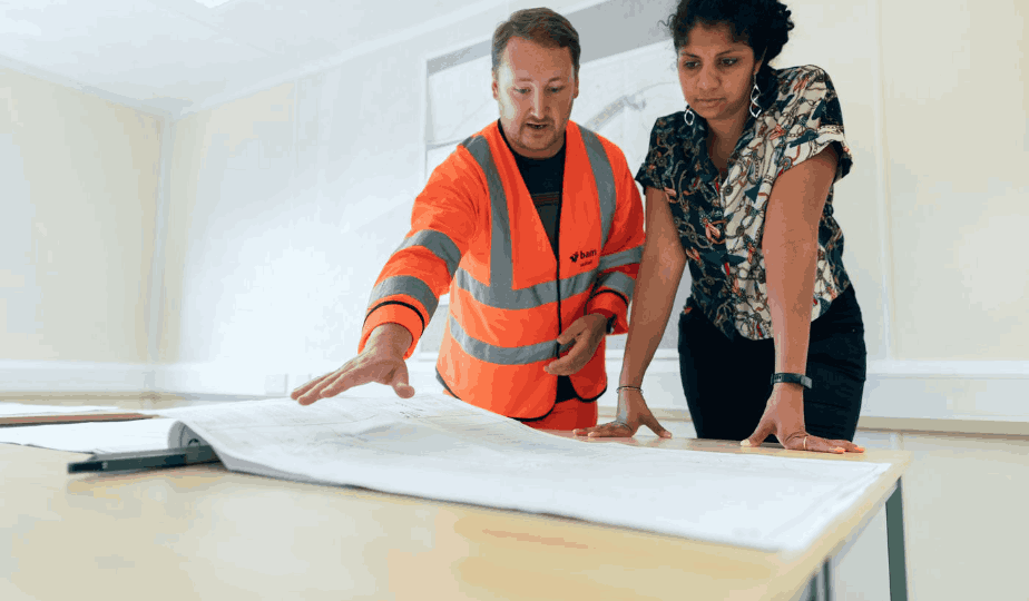 Two engineers reviewing commissioning plans on an industrial project
